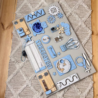 Montessori busy board with doors and locks (40×60 cm)